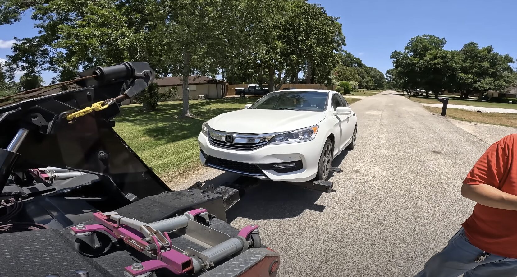 Stranded motorist waiting safely for professional tow truck assistance
